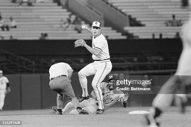 Baltimore, MD- Baltimore Orioles' shortstop Cal Ripken steps over New York Yankees' Dave Winfield after forcing him at second base in fourth inning...