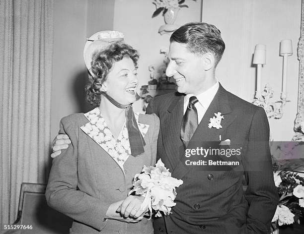 New York, NY- Myrna Loy, beautiful film star, pictured with her husband, John D. Hertz, Jr., after their surprise wedding last night, June 6. The...