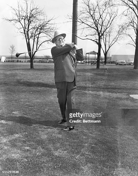 Niles, IL- Golf promoter George May takes a practice drive on the 18th hole at the Tam O'Shanter Country Club, after announcing that he had cancelled...