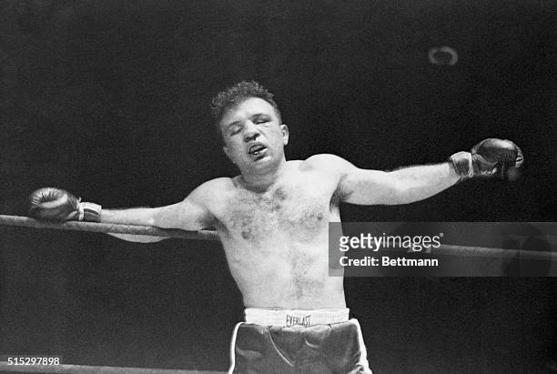 Chicago, IL- Jake La Motta leans on the ring completely stupefied in the 13th round as his left arm gropes for support. As this picture was made,...