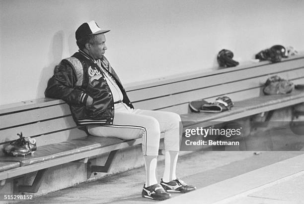 Minneapolis, MN- Oriole manager Frank Robinson sits quietly by himself in the dugout just prior to the Minnesota-Baltimore game. The Orioles lost to...