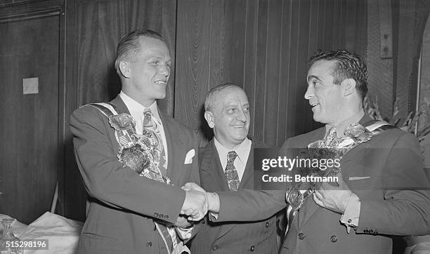 New York, NY - Cerdan Gets Championship Belt. Marcel Cerdan, New Middleweight Champion, recieved a championship belt from Nat Fleischer, President of...