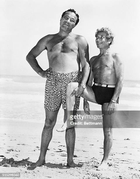 Miami Beach, FLMaxie Baer plays stooge to Harpo Marx on the oceanfront at the Roney Plaza Hotel. It's one of Harpo's well known movie gestures--when...