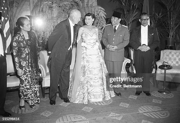 Washington, D.C.- President and Mrs. Eisenhower are greeted by President Achmed Sukarno of Indonesia as they arrived at the Mayflower Hotel for a...