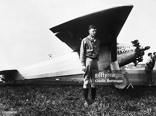 Charles Lindbergh stands in front of the his aircraft, The Spirit of St. Louis, shortly before his solo crossing of the Atlantic ocean.