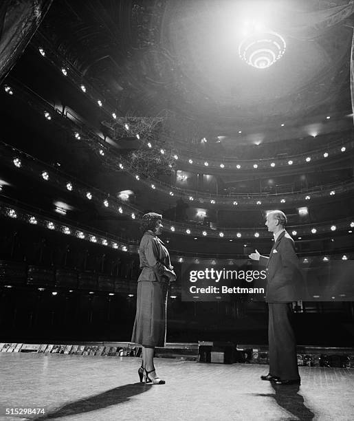 New York- Contralto Marian Anderson is shown viewing the famed diamond horseshoe of the Metropolitan Opera House today with the Met's General Manager...