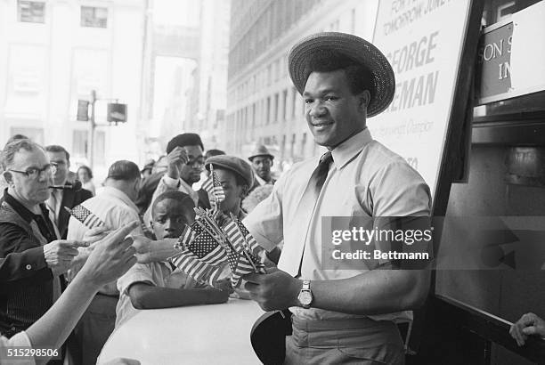 New York,NY- Olympic Gold Medalist Heavyweight boxer George Foreman is all set for Flag Day June 14th,and makes sure passersbys near Madison Square...