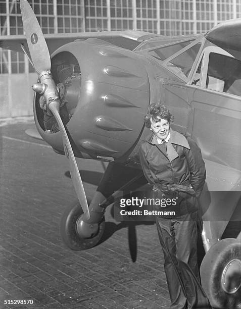 Amelia Earhart, , American aviatrix, first woman to cross the Atlantic Ocean in an airplane. She stands next to the propeller of her plane. Undated...