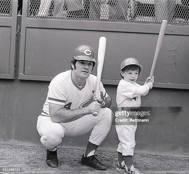 Cincinnati, OH- Pete Rose, who is batting .500 in the National League playoffs with 8 hits in 16 times at bat, gives batting tips to his son, Pete,...