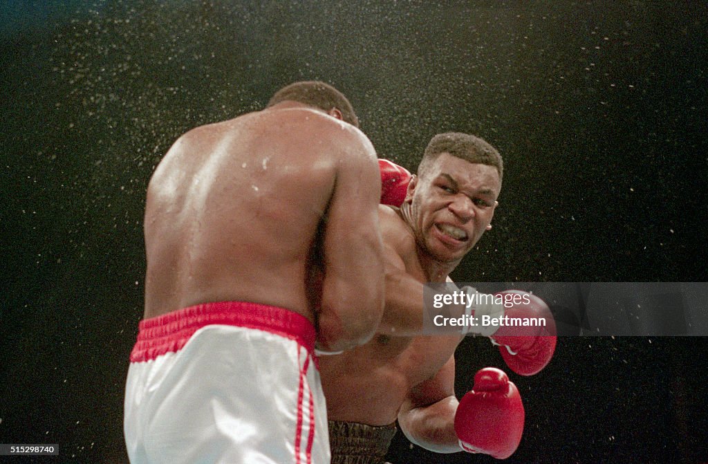 Mike Tyson Delivers KO Punch To Larry Holmes