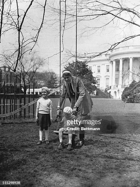 Washington, D.C.- Mrs. Franklin Delano Roosevelt, wife of the President, pictured with her grandchildren Siste and Buzzie Dall, Children of Mrs....