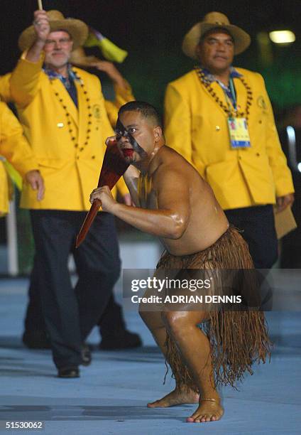 An athlete from Niue Island performs as his delegation arrives during the 2002 Manchester Commonwealth Games opening ceremony 25 July 2002. AFP PHOTO...