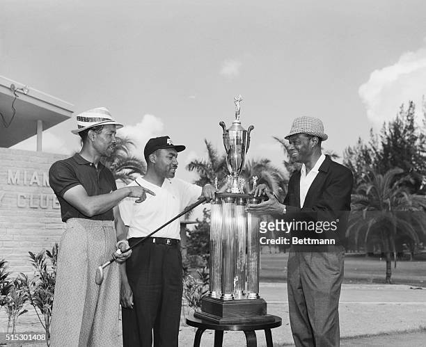 Miami, Florida-TV and night club celebrity Nat "King" Cole pinch hits for his injured friend Roy Campanella, in presenting the Roy Campanella...