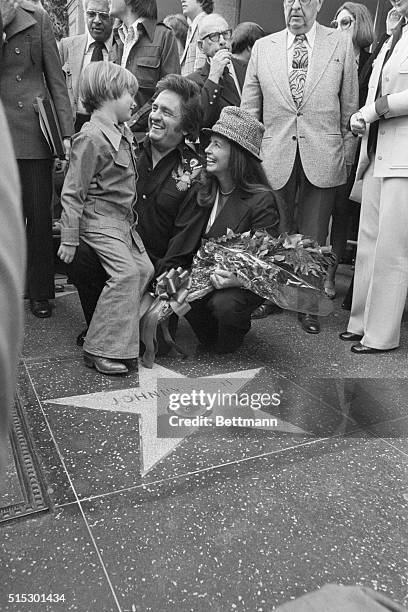 Hollywood, CA-The King of Country Music, Johnny Cash, gets a big laugh from his son, John Carter Cash as his wife June looks on, during Hollywood...