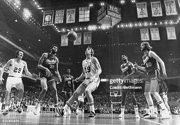 Boston, MA-As if spellbound by the ball, players appear to be frozen in their tracks during second period action of the third game, NBA Championship...