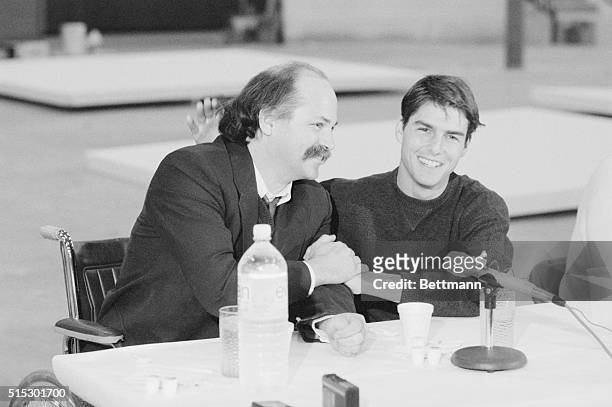 Dallas, TX-Actor Tom Cruise shares a laugh with author Ron Kovic at a Dallas news conference announcing that Cruise will portray Kovic in based on...
