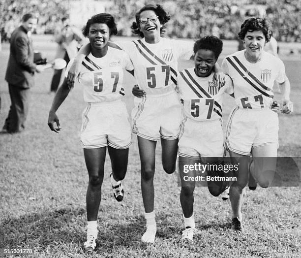 Helsinki, Finland- Members of the U.S. Women's 400 meter relay team cavort on the field after winning the event on the last day of the track and...