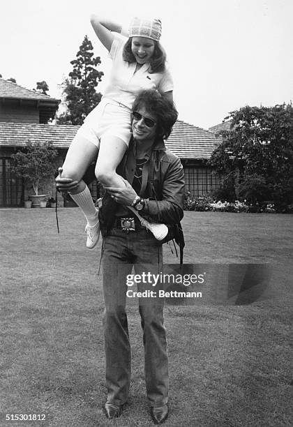 Warren Beatty and Carrie Fisher relax during recent filming of the upcoming Columbia release "Shampoo." Carrie Fisher? She's the daughter of Debbie...