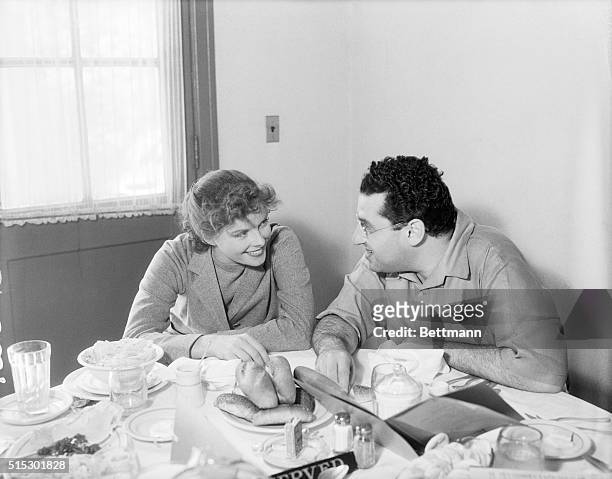Hollywood, California-Katharine Hepburn, well-known stage and screen star, with director George Cukor, seen lunching in the studio cafe, between...