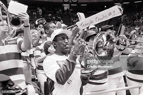 East Rutherford, NJ-Temple alumnus Bill Cosby borrowed a horn to lead the student band before the university's NCAA Eastern Regional final game...