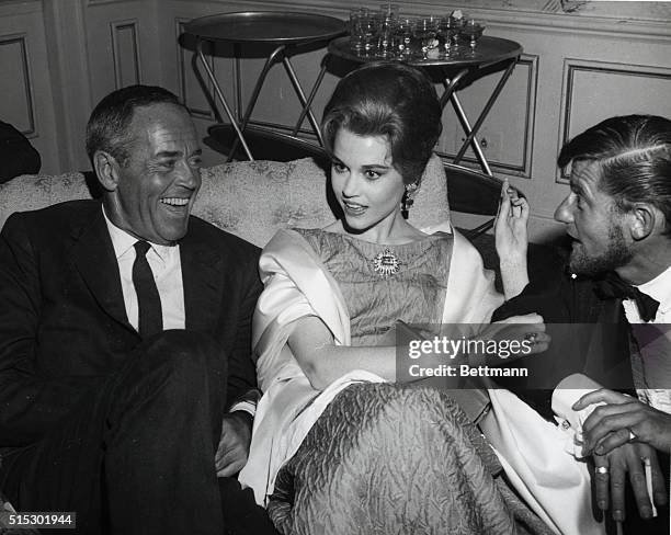 Veteran movie star Henry Fonda and his actress daughter, Jane, congratulate Roddy MacDowell on receiving a plaque in recognition of his services over...