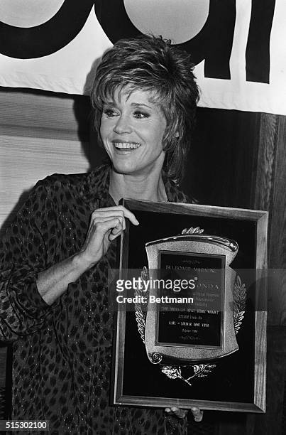 Hollywood, California-Jane Fonda is all smiles as she is presented with "Billboard Magazine's" award for "Jane Fonda's Low Impact Aerobic Workout,"...