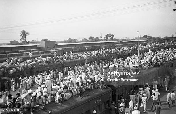 Indian refugees crowd onto to trains as a result of the creation of two independent states, India and Pakistan. Muslims flee to Pakistan and Hindus...