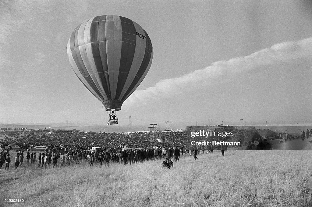 Hot Air Balloon Rising Over Crowd at Altamont Music Festival