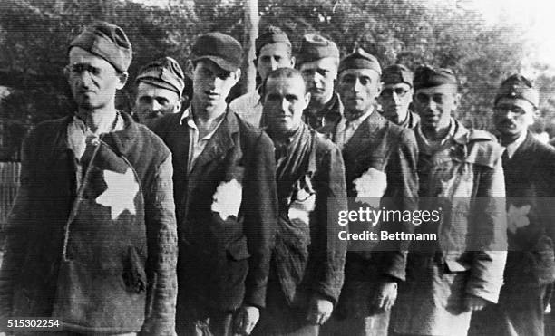 Worn and exhausted from their experiences at the hands of the Nazis is this group of Jews liberated from German camps by Red Army troops. Because of...