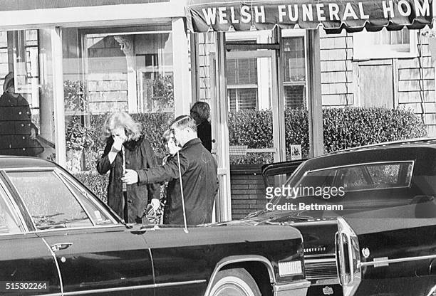 Chelsea, Massachusetts-Weeping, an unidentified woman , leaves the funeral home where private services were held for the self-admitted "Boston...