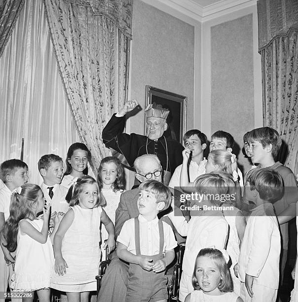 Kennedy children sing at a 70th birthday party for Cardinal Richard Cushing. Cushing performed the marriage of John F. Kennedy and Jacqueline...