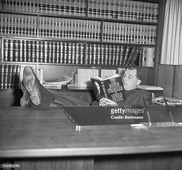 Marshfield, Massachusetts-One of today's most publicized defense lawyers, F. Lee Bailey, relaxes in his home library with a book about one of his...