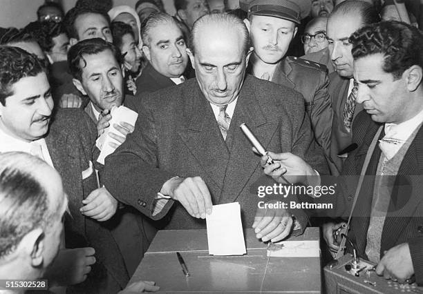 Damascus, Syria- President Shukri Al-Kuwatly of Syria is shown as he cast his ballot in last Friday's plebiscite when Syrians and Egyptians voted on...