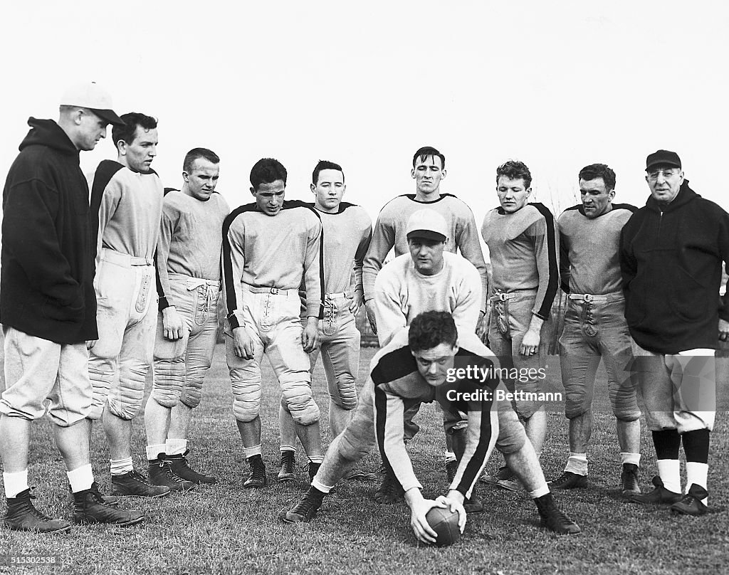 Sid Luckman with Football Players