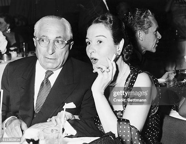 Louis B.Mayer and wife, Lorena Danker sitting together at a night club. The couple were married in 1948 and remained together until Mayer's death in...