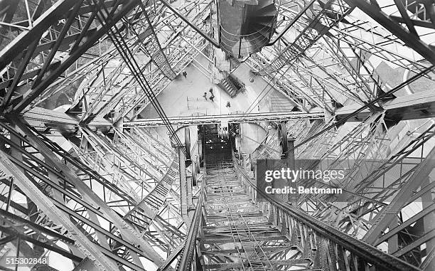 Paris, France-: Thirty tons of paint are being used in the repainting of the Eiffel Tower, and now workmen are now nearly finished with this...