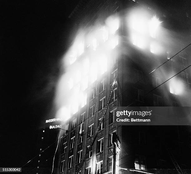 Atlanta,GA: Searing flames burst from the windows of the Winecoff Hotel at the height of the fire that gutted the building, causing the deaths of 120...