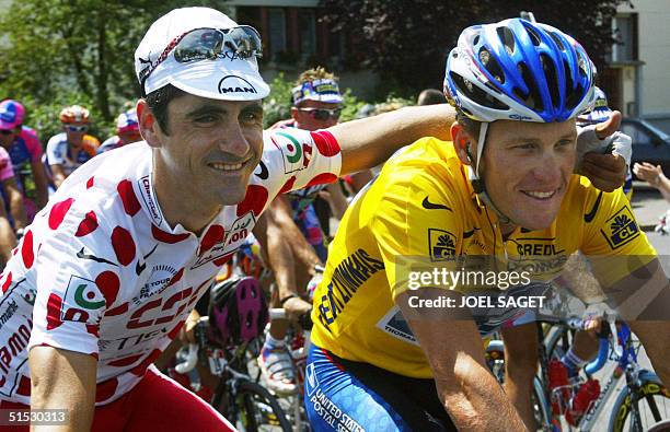 Yellow jersey, leader of the US Postal Service team, US Lance Armstrong and Polka-dot jersey of best climber, leader of the Danish CSC-Tiscali team,...