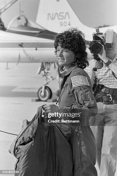 Space shuttle mission specialist Sally Ride, the first American woman sent into space, totes her luggage following her arrival at the Kennedy Space...