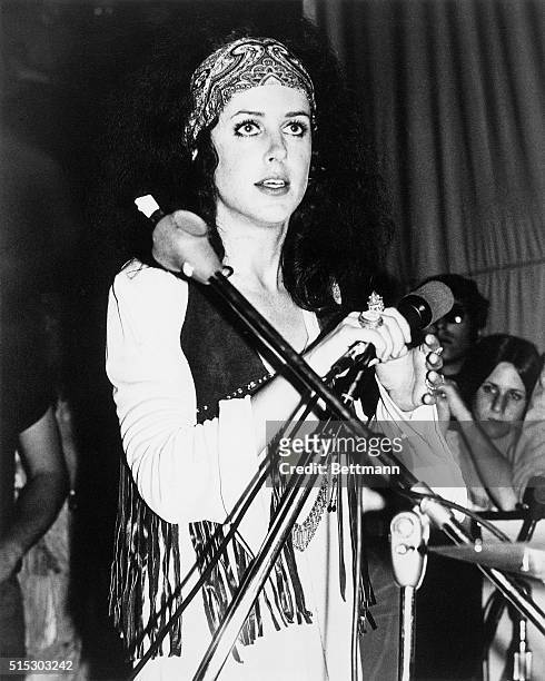 Picture shows a portrait of Grace Slick of Jefferson Airplane performing in concert on stage.