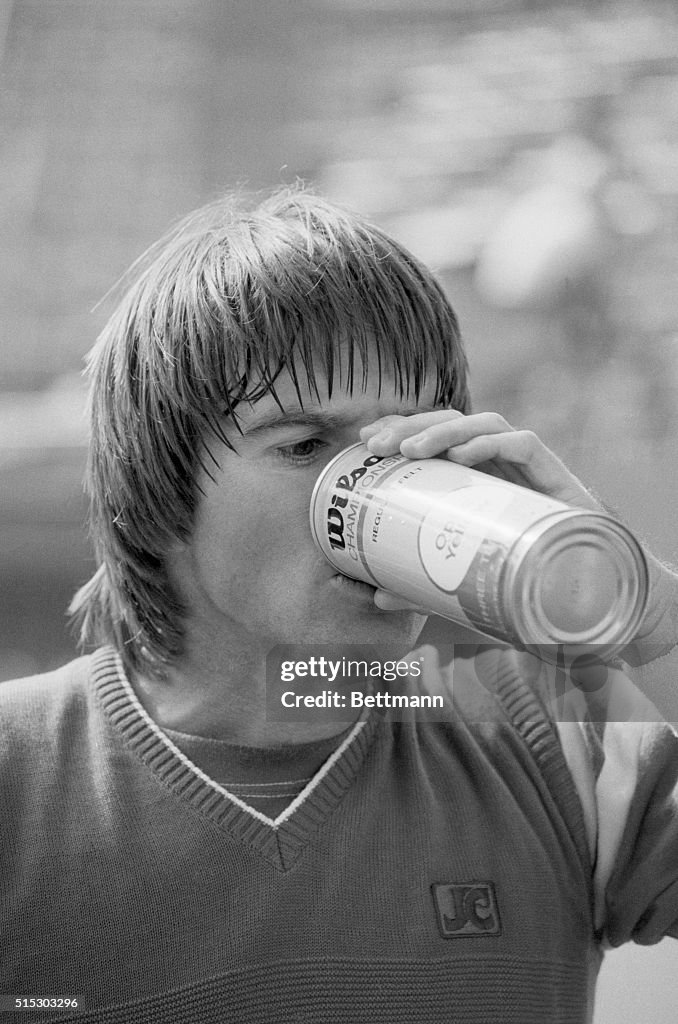 Jimmy Connors Drinking from Ball Can