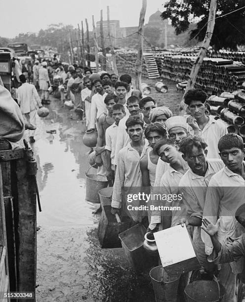 Muslim refugees are shown here; some of the 100,000 victims of Religious rioting who have taken refuge in the congested Purana Qila Fort on the...