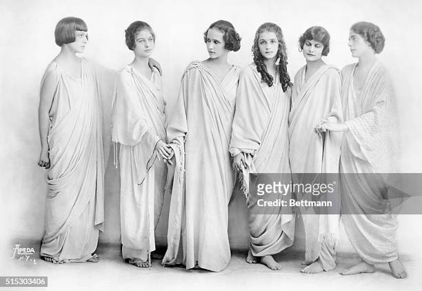 The Isadora Duncan dancers are shown in classical robes and classical pose. Undated photograph.