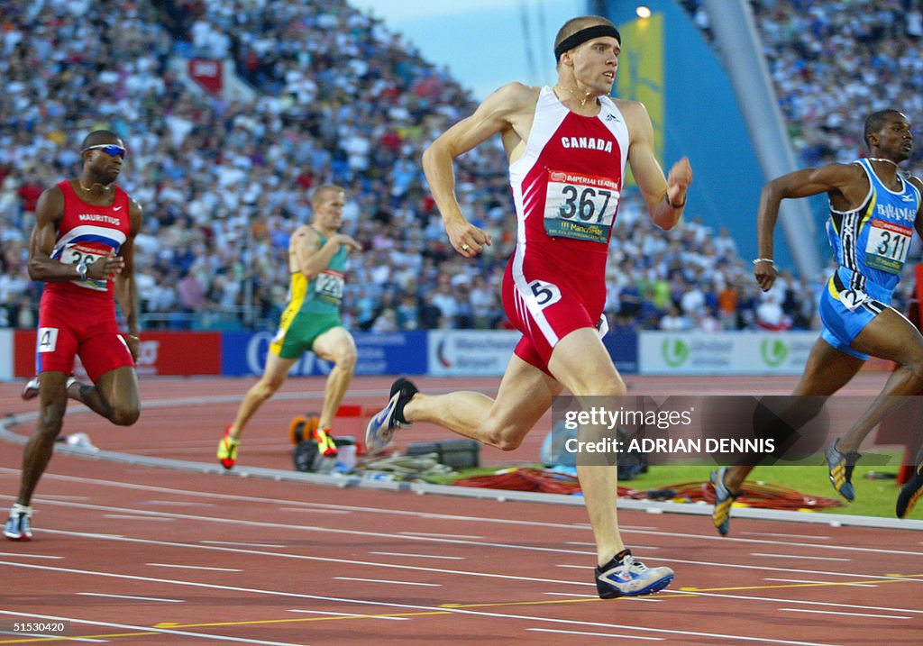 Canadian silver medalist Shane Niemi (C) runs next