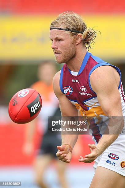 Daniel Rich of the Lionshandballs during the NAB Challenge AFL match between the Brisbane Lions and the Greater Western Sydney Giants at Metricon...