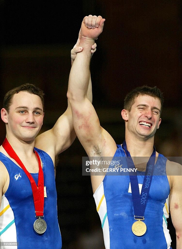 Phillipee Rizzo Philippe Rizzo of Australia has his hand held high by silver medalist ...