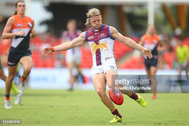 Daniel Rich of the kicks during the NAB Challenge AFL match between the Brisbane Lions and the Greater Western Sydney Giants at Metricon Stadium on...