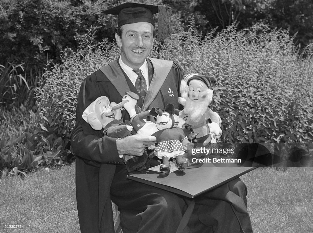 Walt Disney Holding Character Dolls
