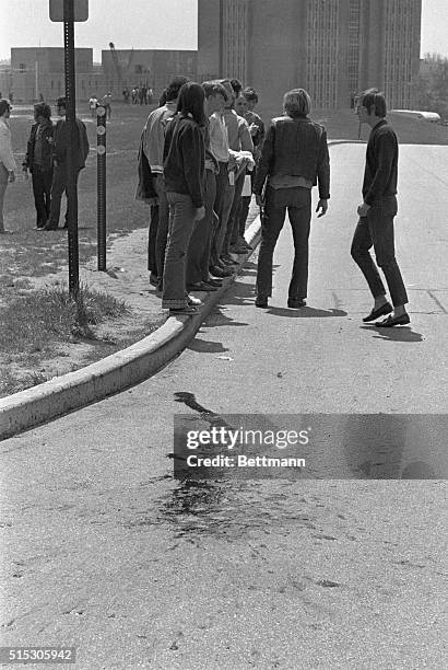 Kent, OH: Picture shows students of Kent State walking away from the riot scene at the University where police open fire on a protest on the campas....