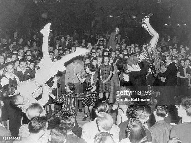 Ocean Park, CA- Wild hysteria that makes the modern jitterbug is captured in this photo of "Solid Senders Blowing Their Tops" at a jam session in the...